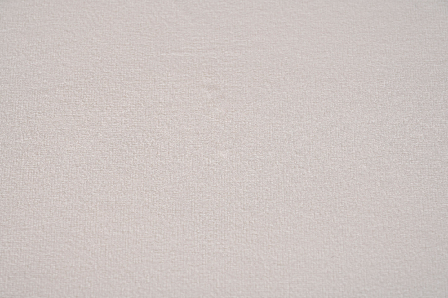 Como fåtölj i beige sammet